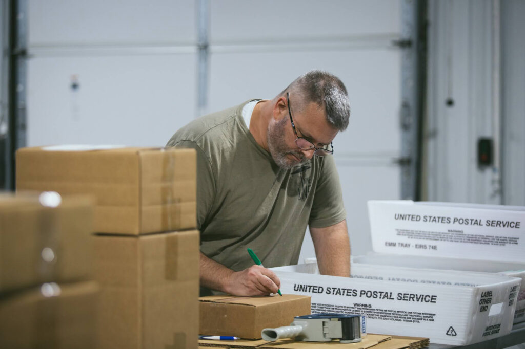 Geoff Stephens works on a direct mail piece at Trevett's.