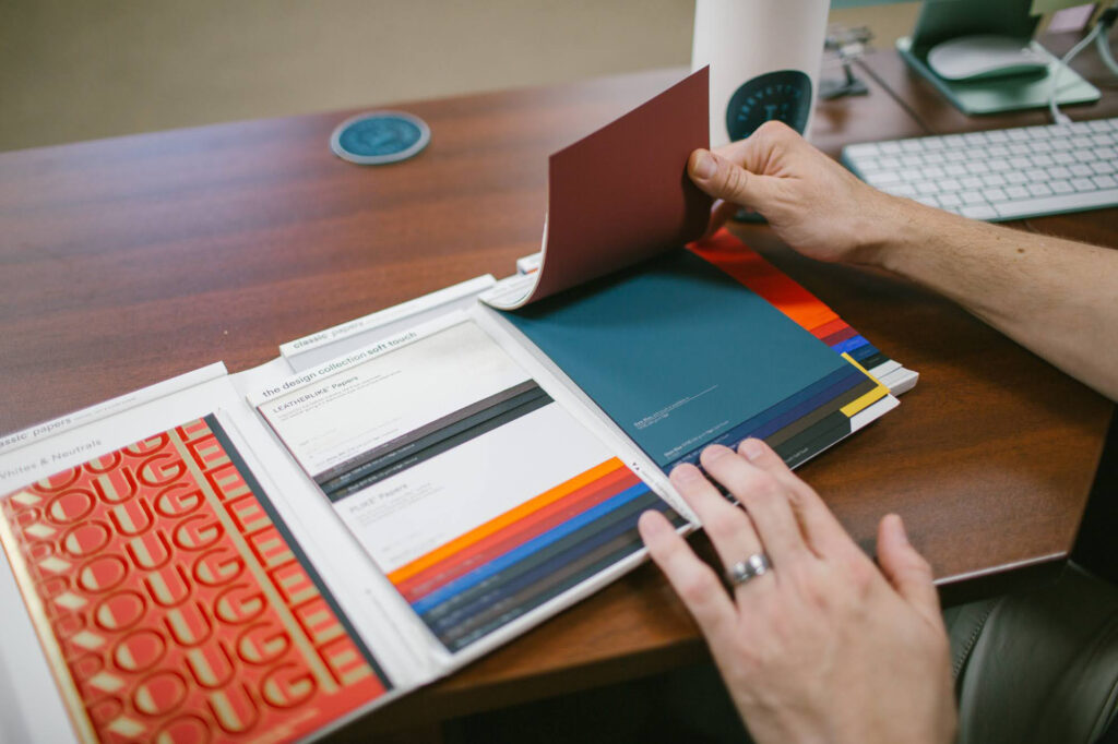 Trevett's employee reviewing paper samples